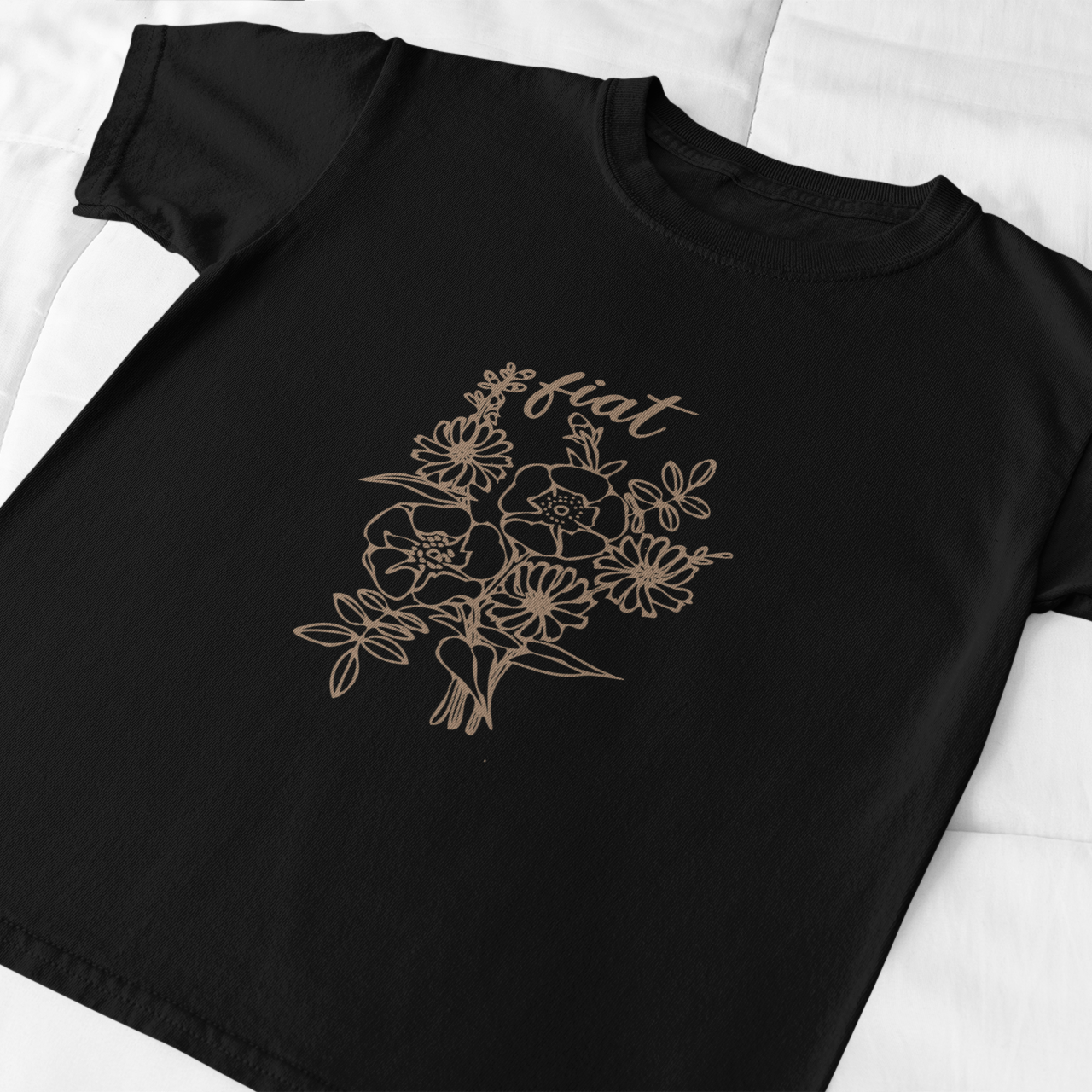 Black t-shirt with floral design and 'eat' text on a white background