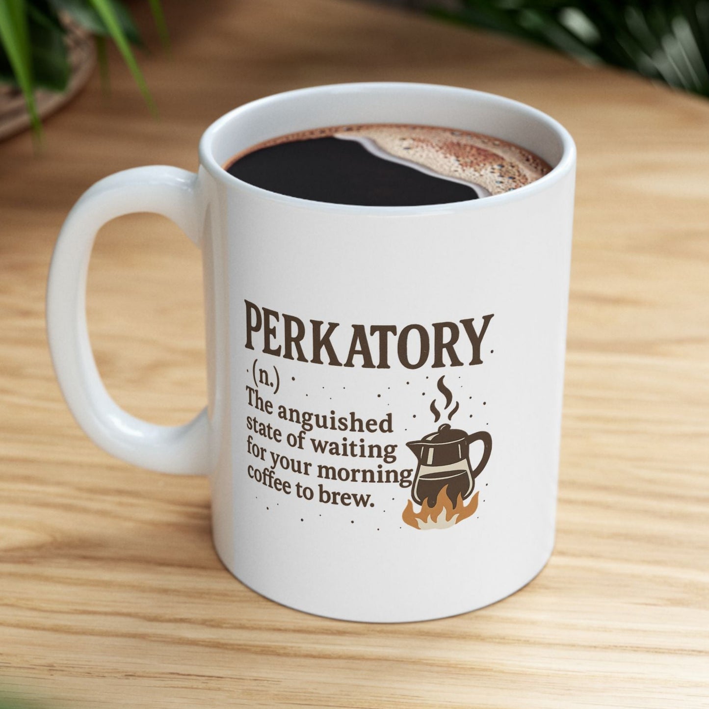 White mug with 'Perkatory' definition and coffee design on a wooden table