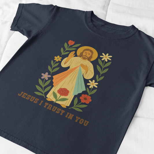 Navy blue t-shirt with a graphic of Jesus and text 'Jesus I trust in you' on a white background
